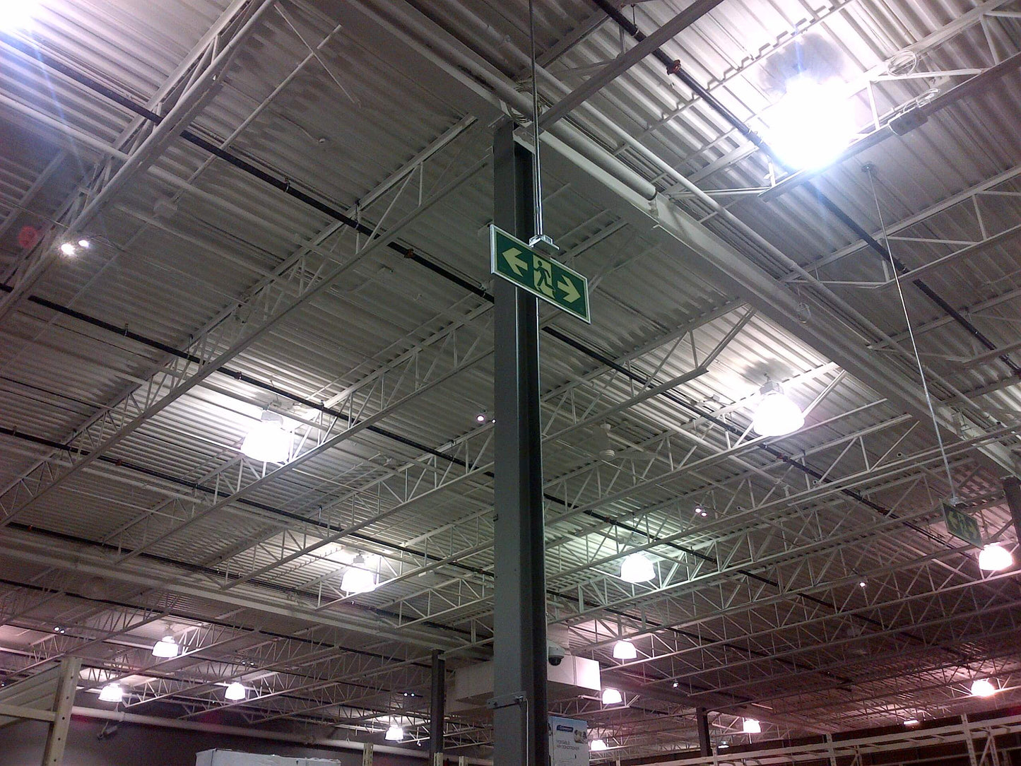 Door Mounted Pathmarking Sign. Running Man with Exit. 3M Double Sided Tape