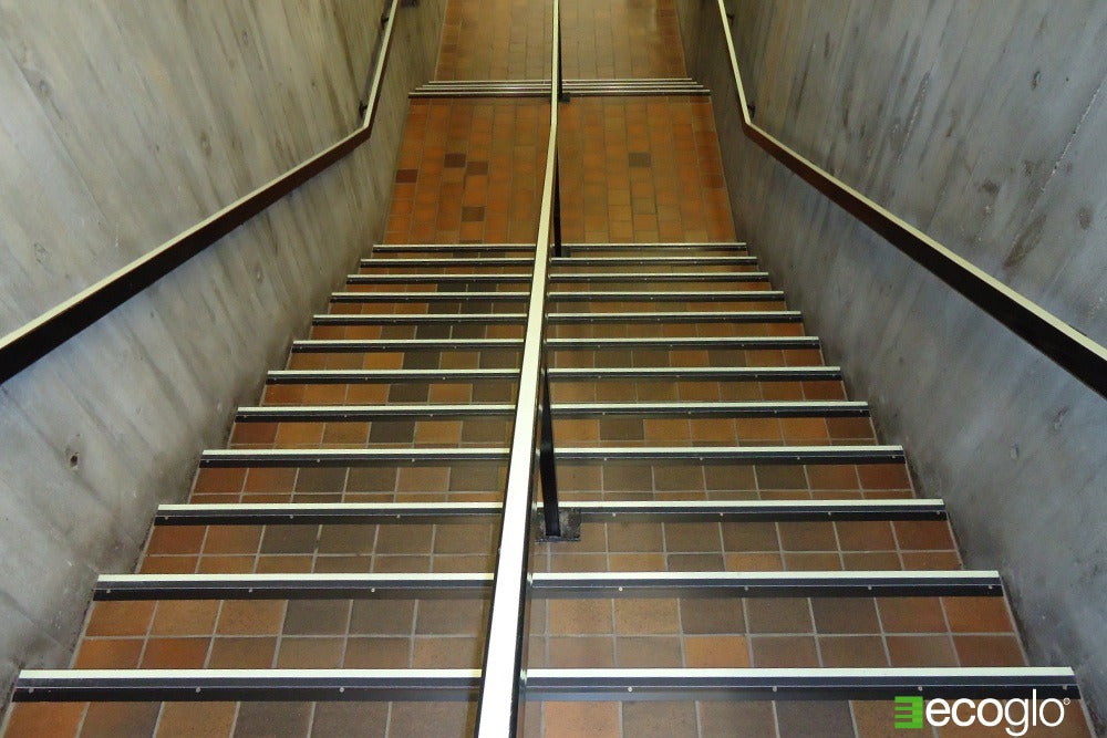 Ecoglo non slip strips installed on Oakville Public Library staircase.